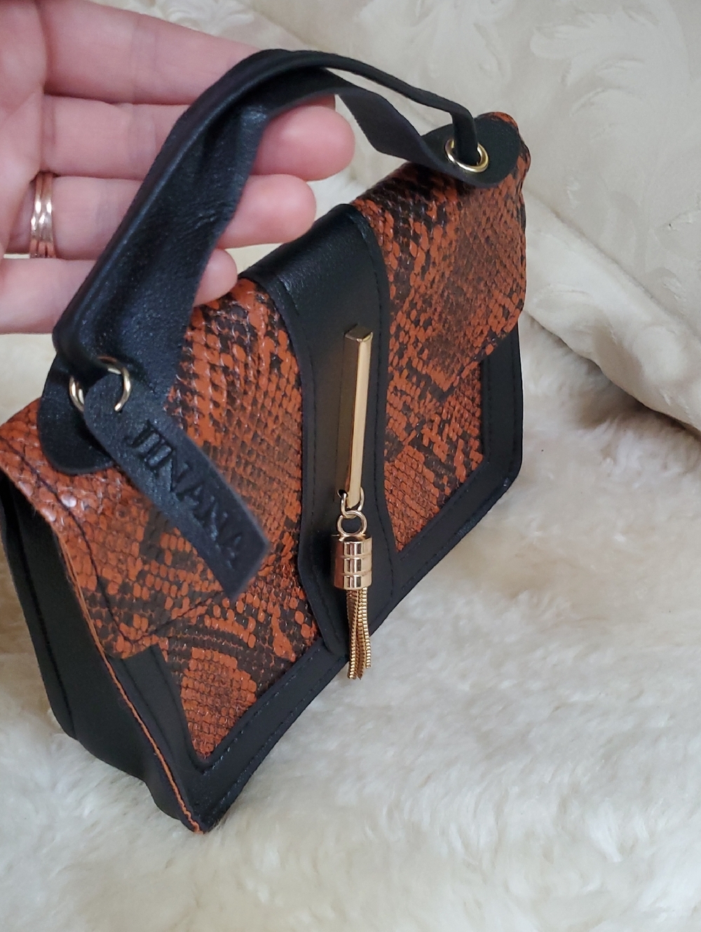 Black & Orange Snake-Print Top-Handle Bag with Gold Tassel